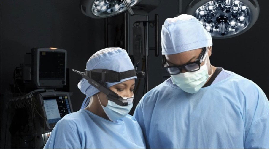 Fig. 2 Surgeons using augmented reality glasses during traditional open-field surgery.